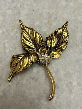 M.Jent signed vintage gold-tone leaf flower accented clear crystals brooch
